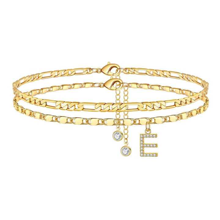 Detailed view of a personalized gold anklet for women, initial 'B' and crystal, adjustable fit