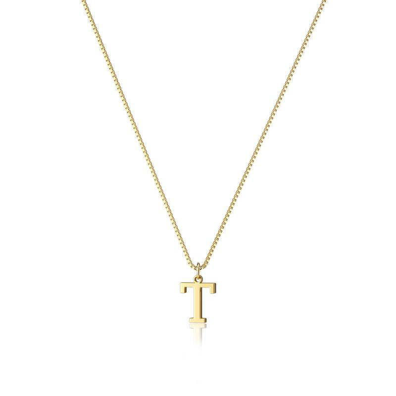 Close-up of gold plated initial pendant, women's jewelry detail