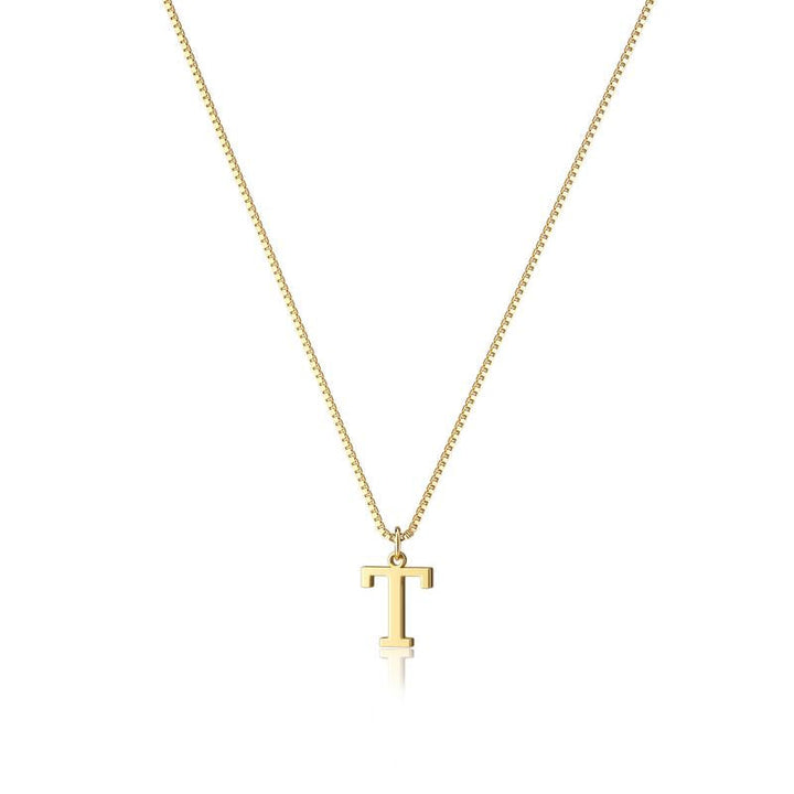 Close-up of gold plated initial pendant, women's jewelry detail