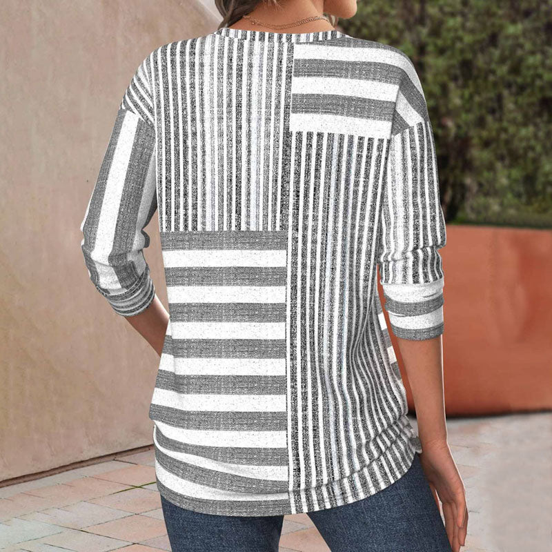 Chic women's striped three-quarter sleeve top, perfect for everyday style, versatile and modern fashion blouse.
