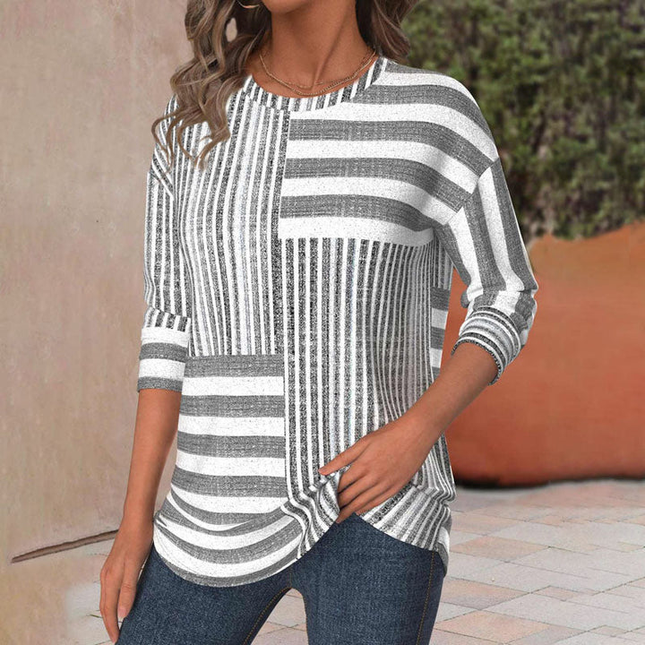 Modern women's gray blouse with panel stripes & three-quarter sleeves. Effortless everyday fashion and workwear.