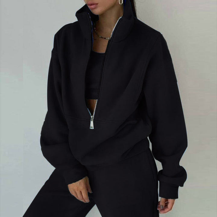 Relaxed fit women's half-zip loungewear set. High-waisted joggers & matching pullover for casual comfort & travel.