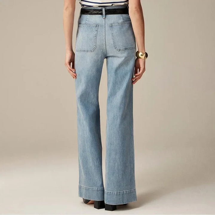 Close-up of women's high-waist capri denim trousers fabric, showing stretch, 5-pocket style