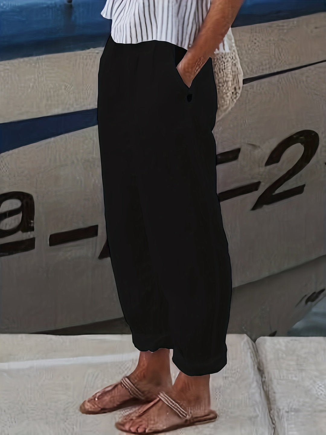 Casual women's pants for everyday, high waist, relaxed silhouette, and roll hem style.
