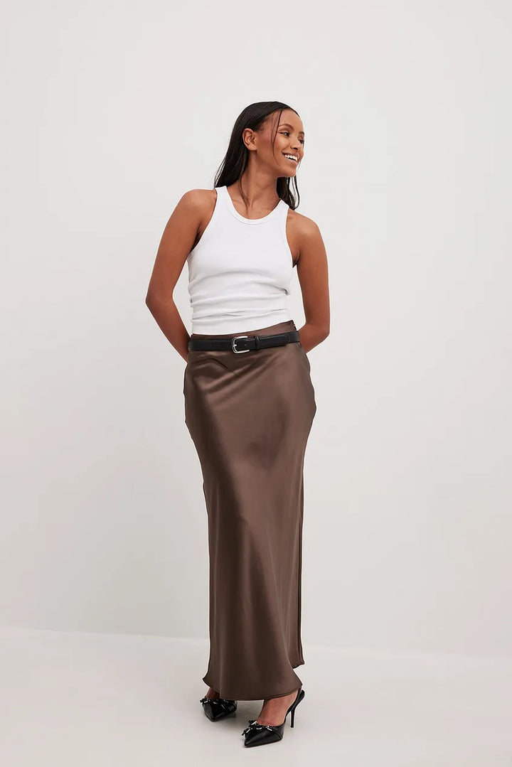 Elegant flowing satin midi skirt, high-waist and sophisticated for modern women's fashion.
