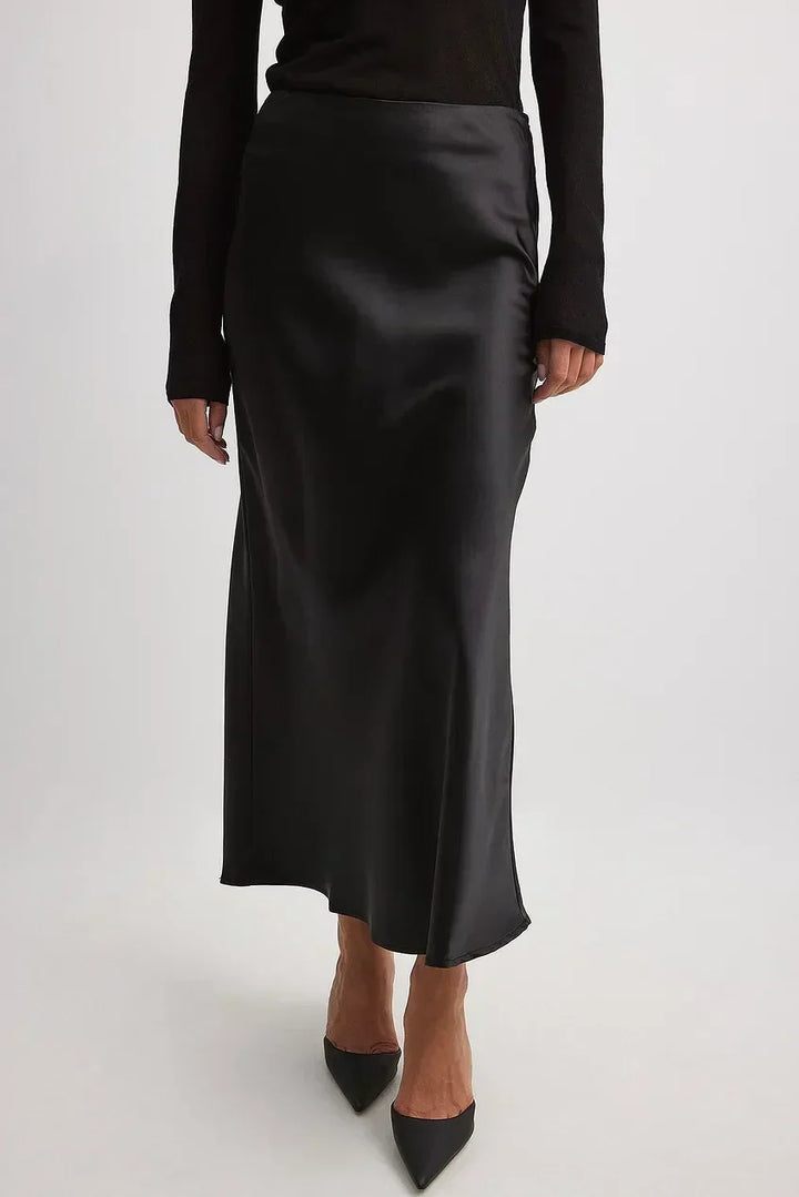 Elegant high-waist midi skirt for women, featuring beautiful flowing satin fabric.