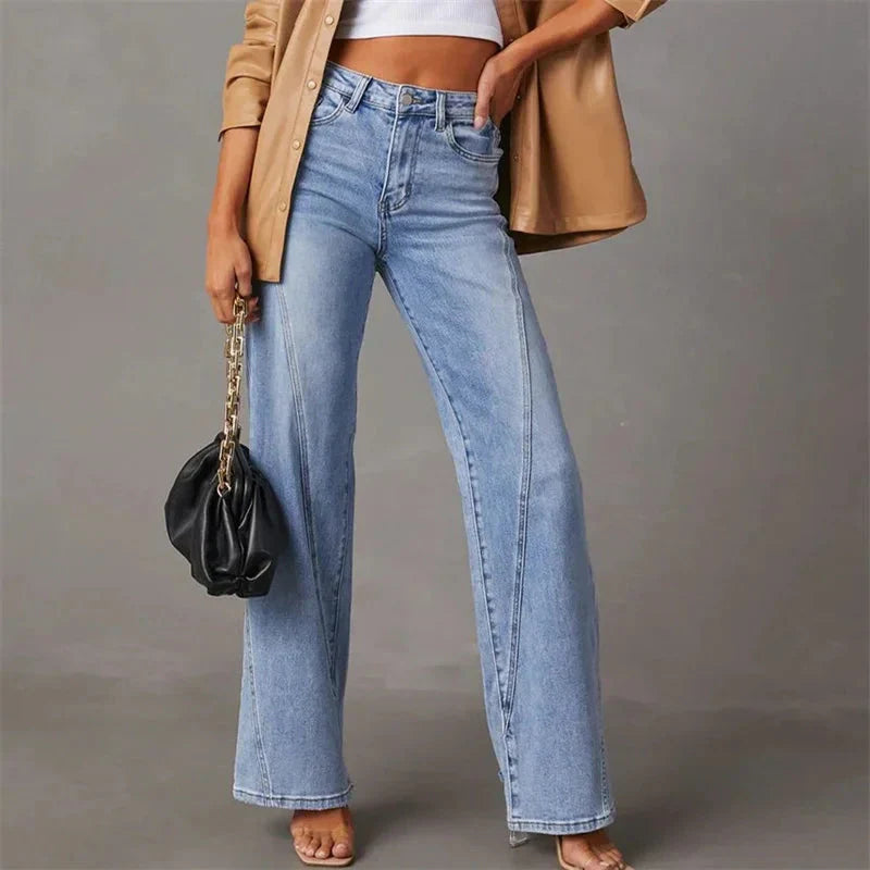Close-up of the durable denim fabric and high-waist detail of women's wide-leg jeans, ideal for spring.