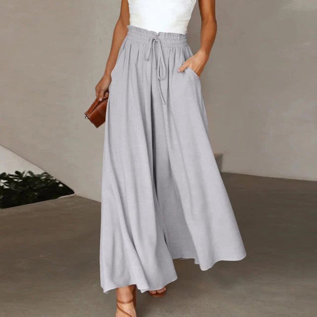 Stylish women's wide leg summer pants, high waist, drawstring & pockets for a flowy, relaxed, casual look.