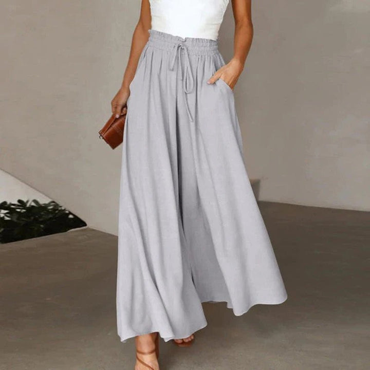Stylish women's wide leg summer pants, high waist, drawstring & pockets for a flowy, relaxed, casual look.