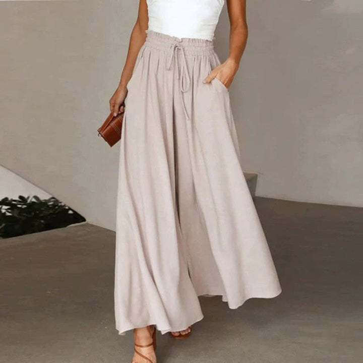 Versatile women's flowy wide leg pants, high waist with drawstring & pockets, ideal for casual everyday wear.