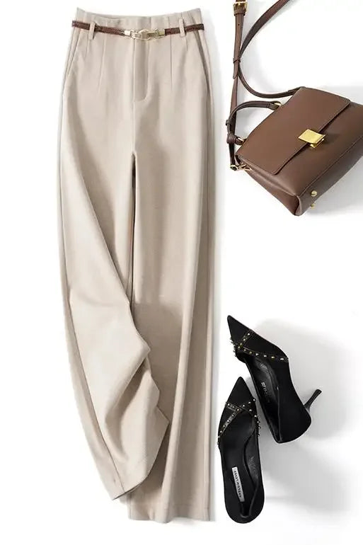 Folded women's wool blend wide-leg trousers, emphasizing the quality and drape of the fabric