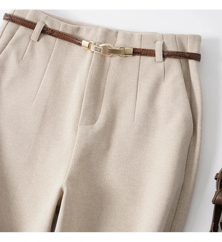 Detailed stitching on women's high-waist wide-leg trousers, made from durable wool blend