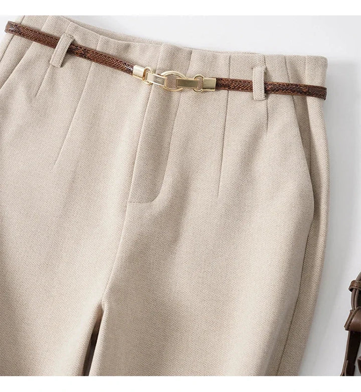 Detailed stitching on women's high-waist wide-leg trousers, made from durable wool blend