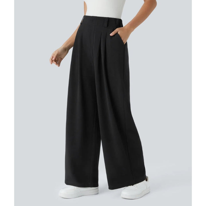 Model wearing women's high waisted waffle knit wide leg pants, paired with a casual top