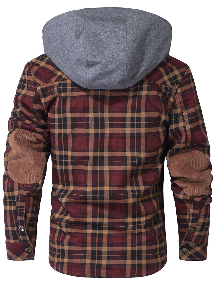 Flat lay of a women's hooded flannel jacket, displaying its design and warm faux fur interior