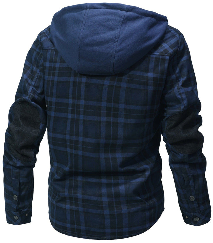 Lifestyle image of a woman walking in a park, wearing a durable hooded flannel faux fur jacket