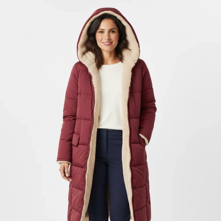 Stylish women's winter puffer jacket, quilted and hooded for cold weather comfort.