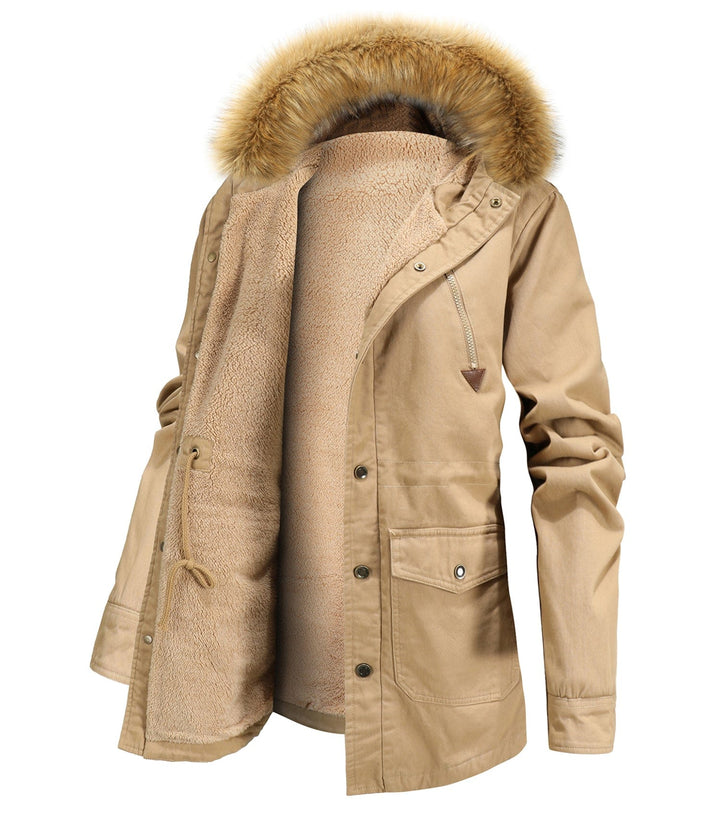 Female model wearing a black insulated hooded winter parka, perfect for snow