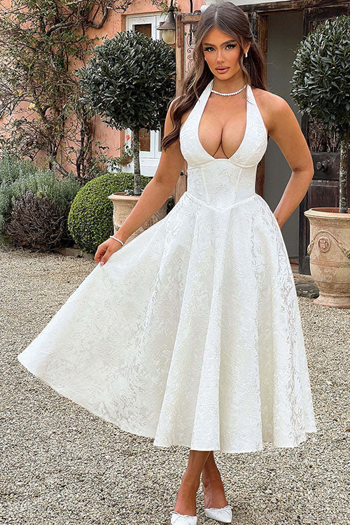 Formal A-line tea-length jacquard dress with halterneck, ideal for women's evening wear.