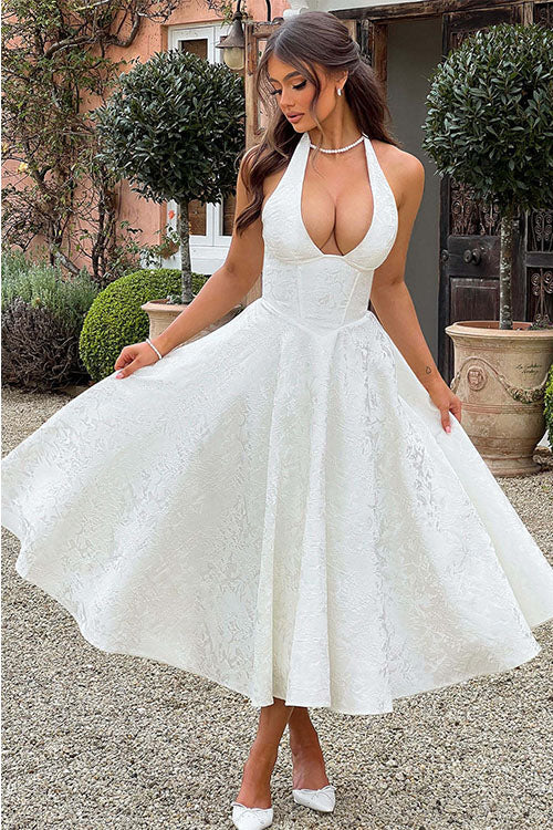 Elegant women's tea-length jacquard dress, A-line cut with a stylish halterneck for formal wear.