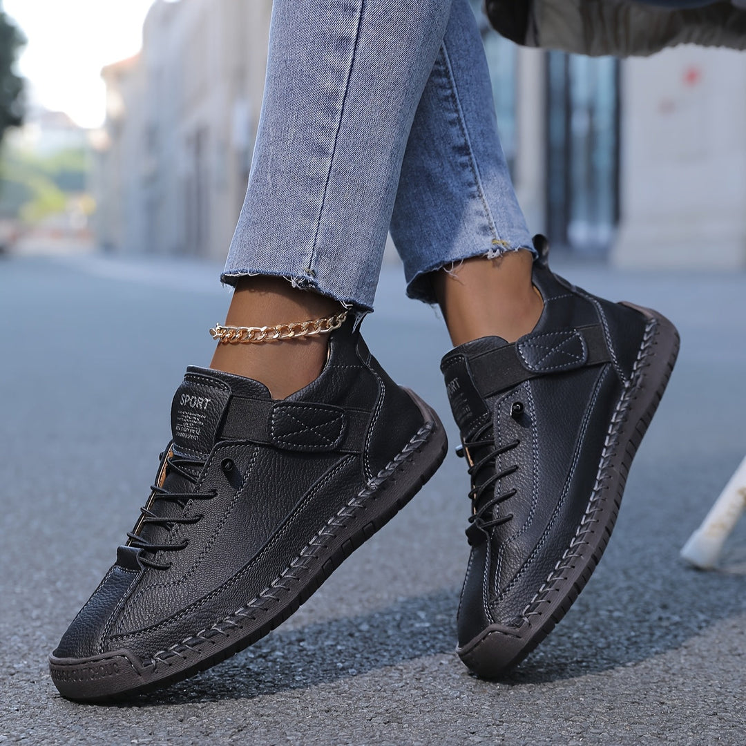 Comfortable women's walking shoes, lace-up flat sneakers with stylish decorative stitching for versatile wear.