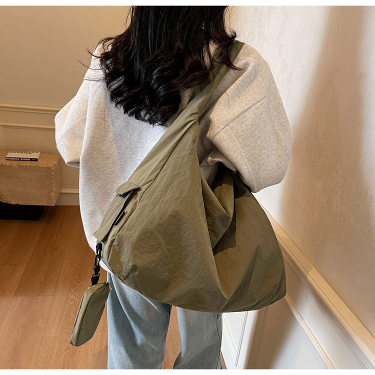 Women's large capacity casual crossbody bag with adjustable strap, perfect for everyday use.