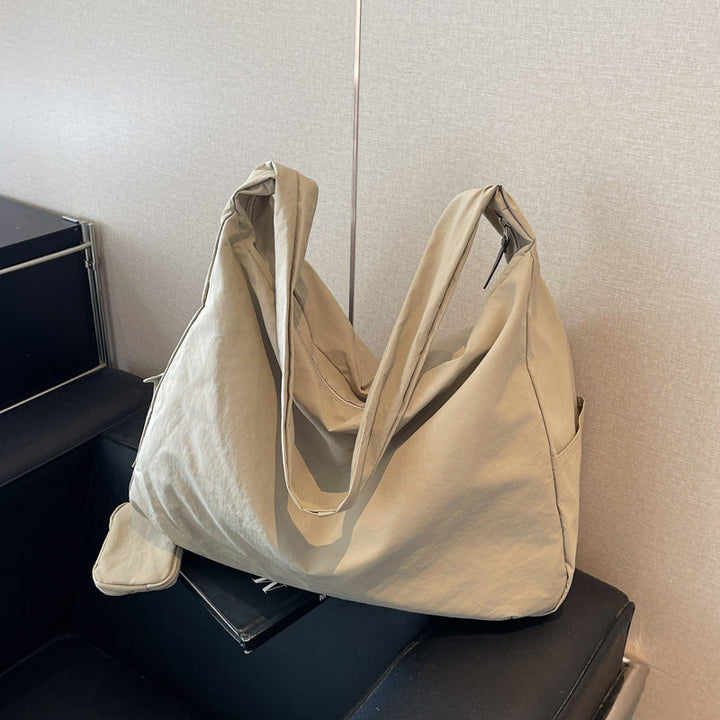 Stylish women's hobo crossbody bag in black, offering large capacity & comfort for daily essentials.