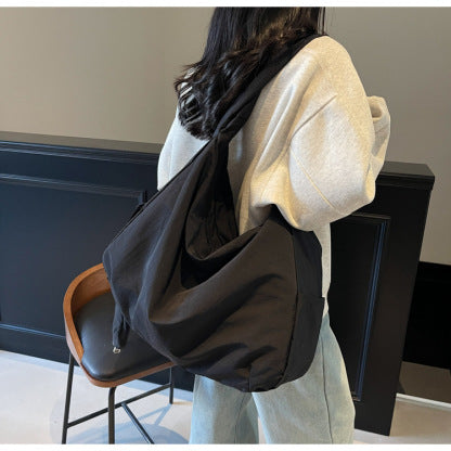 Navy blue women's casual shoulder bag, large capacity crossbody with a comfortable adjustable strap.