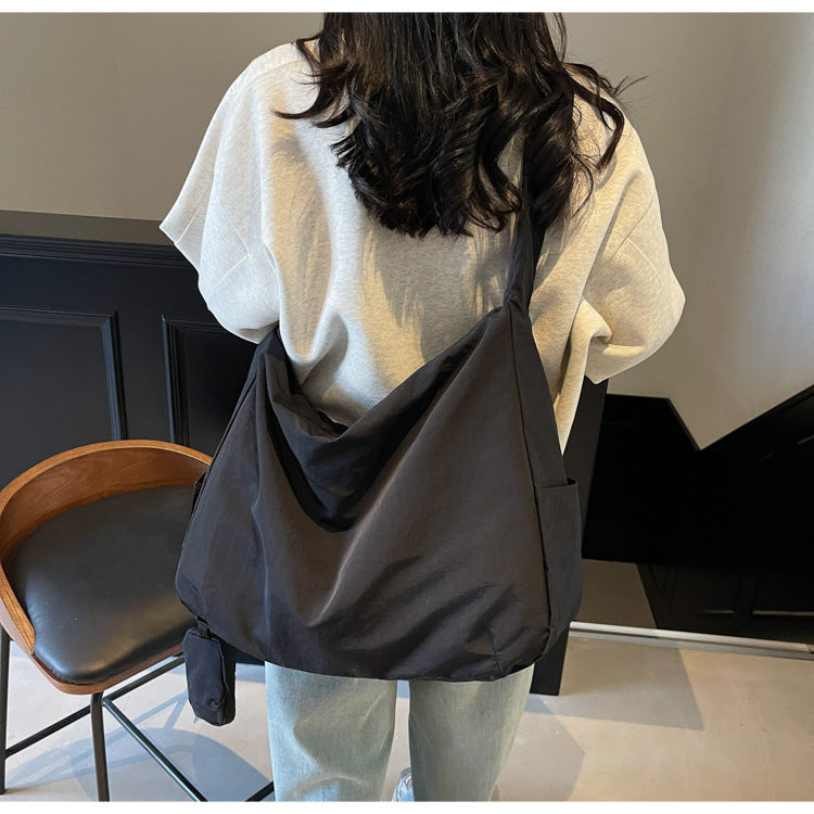 Khaki women's hobo style crossbody bag, perfect for everyday casual use with ample space.