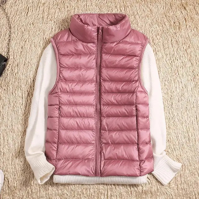 Fashionable women's sleeveless quilted vest with a stand-up collar, perfect for adding warmth without bulk