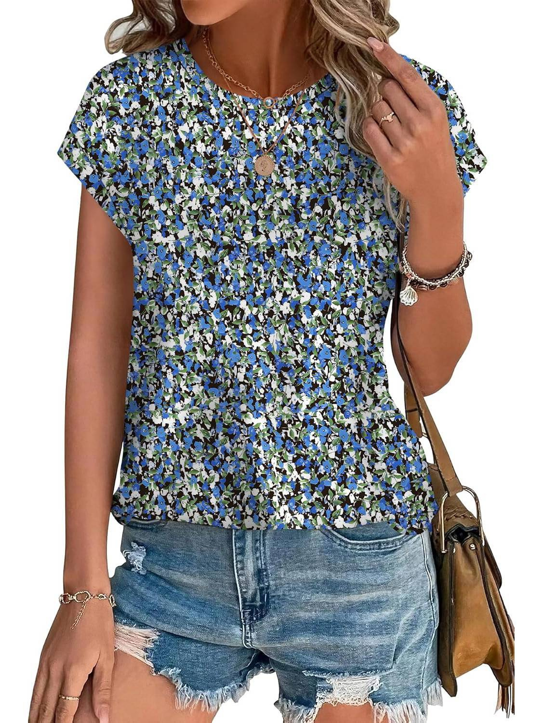 Lightweight women's cap sleeve top with eye-catching botanical leaf print. Great for summer.