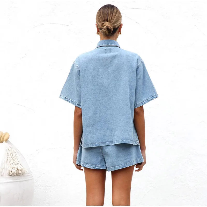 Women's denim two-piece shorts set, folded neatly to display its lightweight fabric and design