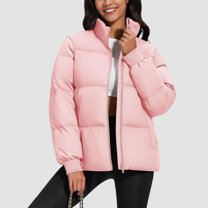 Side view of a women's black puffer jacket, quilted, showing slim fit and warmth