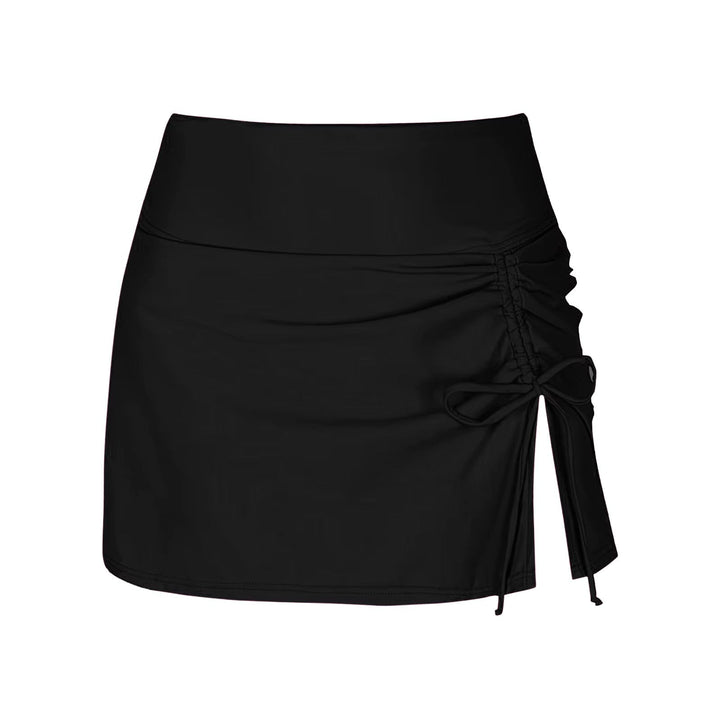 Close-up of quick-dry fabric on Liv women's side slit swim shorts, showing texture & quality for beachwear.