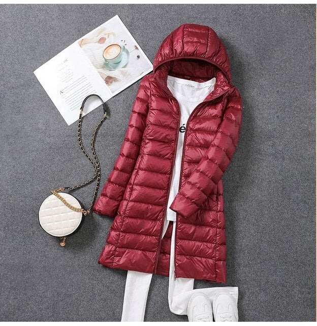 Women's long puffer jacket, warm winter coat with detachable hood. Ideal for cold weather & cozy fashion.