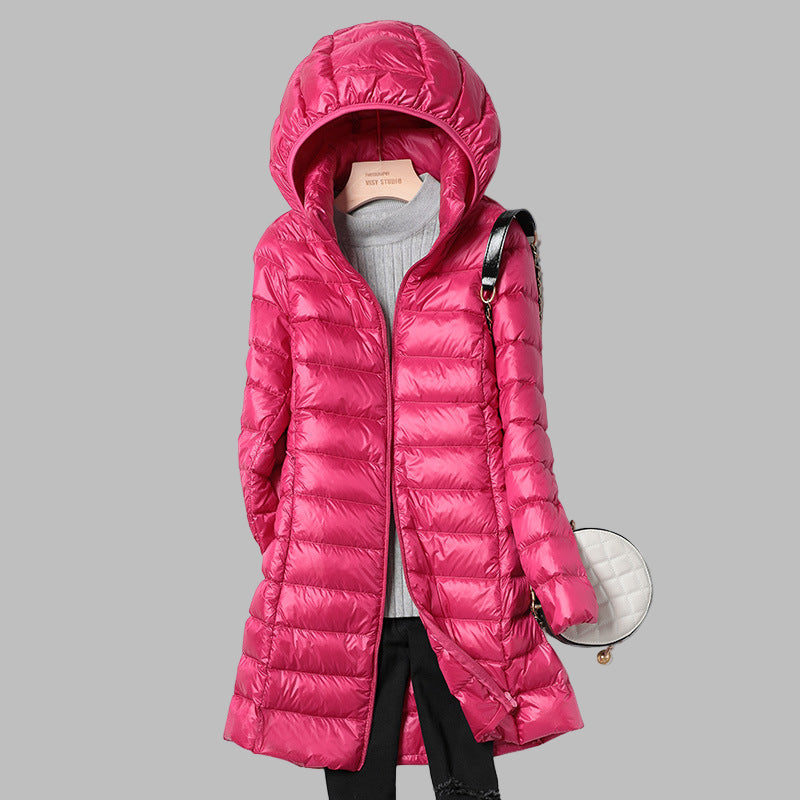 Long women's puffer jacket, warm winter outerwear. Detachable hood adds versatility for cozy fall & winter fashion.