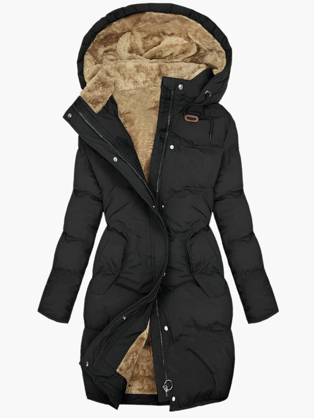 Close-up of a women's warm, long quilted hooded coat, showing texture and zipper detail, winter outerwear