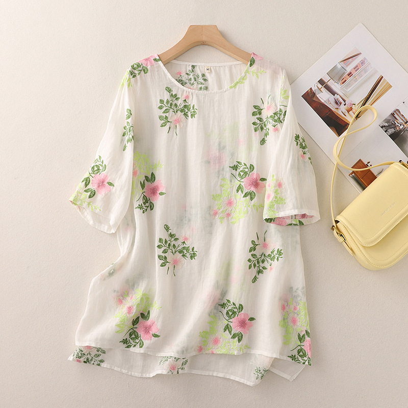 Casual women's blouse featuring beautiful floral embroidery and a relaxed, loose fit design