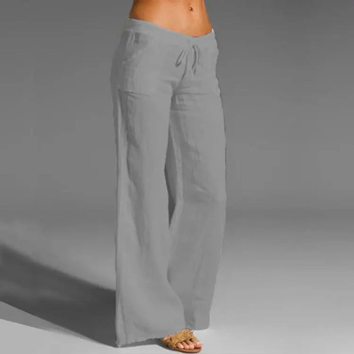Breathable women's linen pants, ideal for summer. Features a comfortable loose fit, suitable for beach or casual wear.