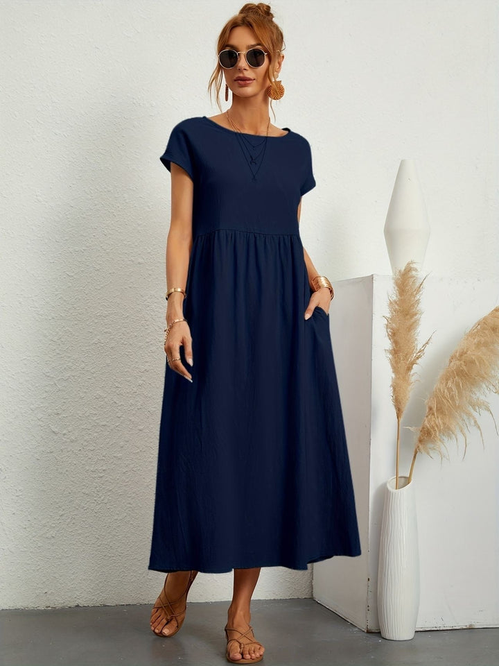 Summer fashion women's loose fit maxi dress with short sleeves, round neck, and convenient pockets.
