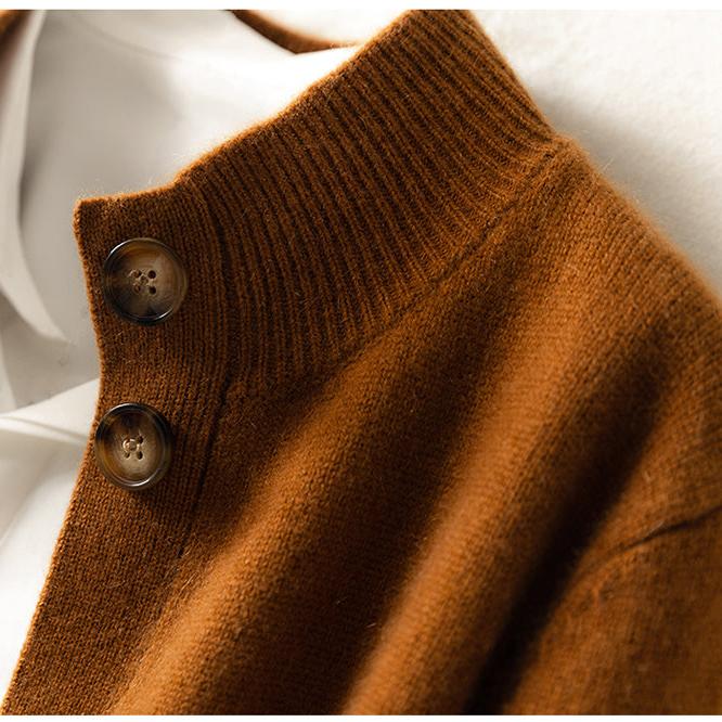 Model smiling, wearing the soft button-front cashmere blend knit cardigan