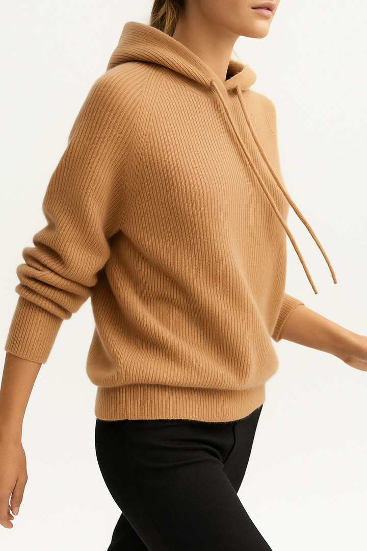 A stack of folded Women's Luxe Cashmere Blend Relaxed Hoodies, various colors