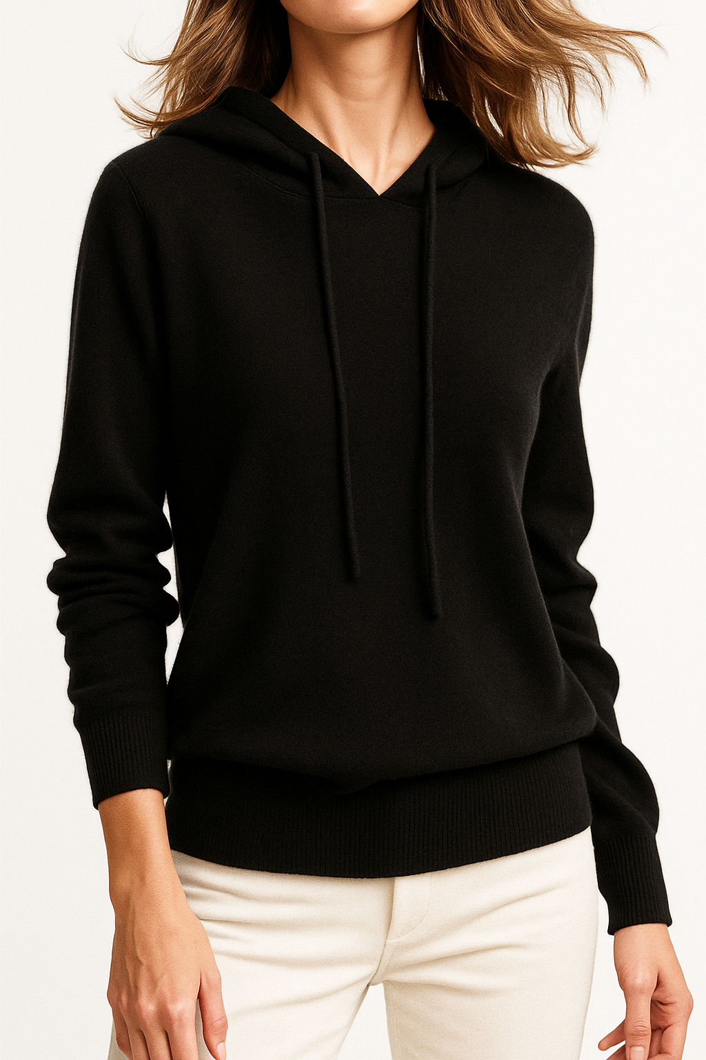 Side profile of a woman in the cozy cashmere blend relaxed hoodie, natural light