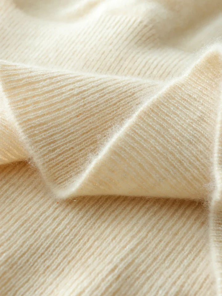 Cozy women's fashion: the Luxe Cashmere Knit Crossover Sweater, offering unparalleled softness