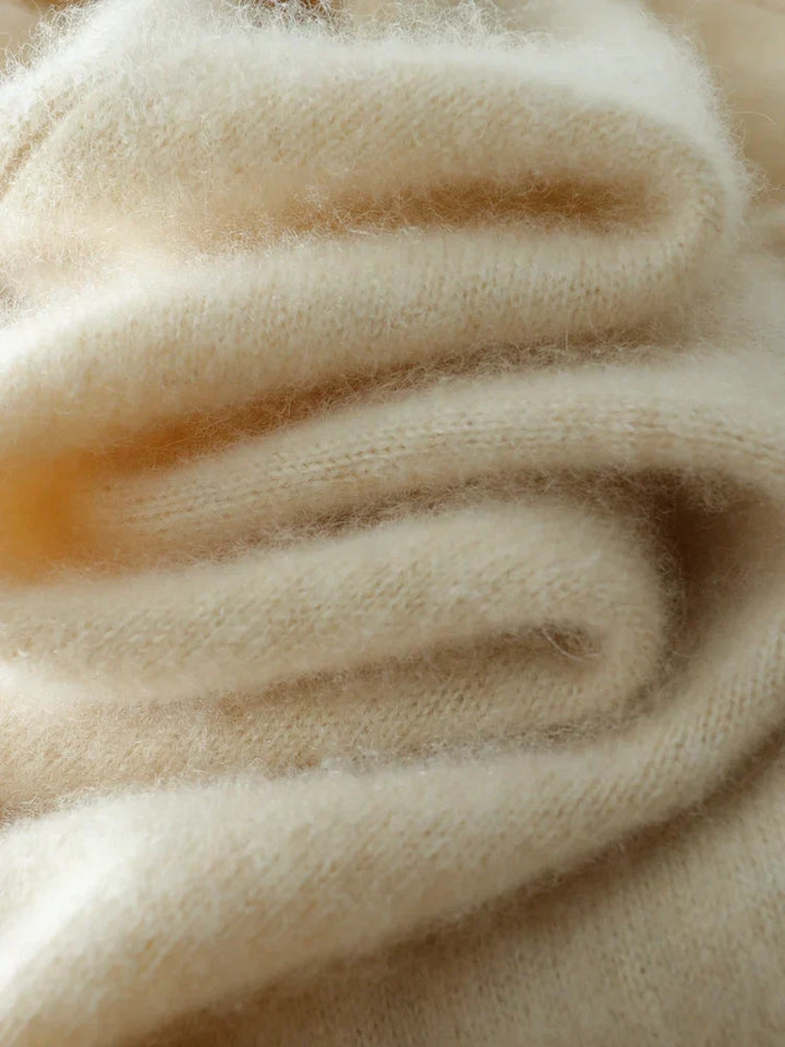 High-quality women's sweater, the Luxe Cashmere Knit Crossover with an elegant neckline, winter chic