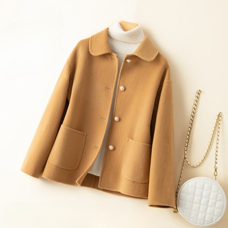 Women's luxurious pure cashmere cropped coat with an elegant doll collar, ideal for winter and fall fashion.