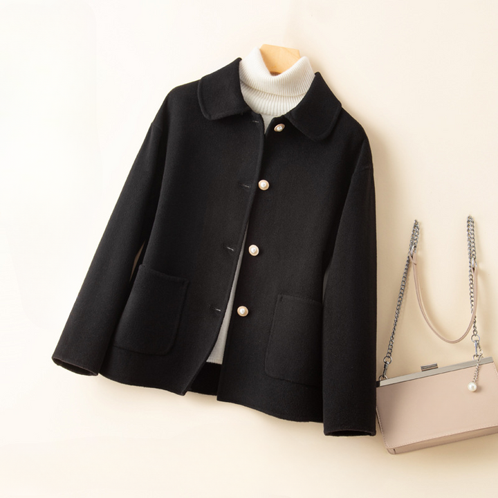 Elegant women's outerwear: a pure cashmere cropped coat with a classic doll collar, suitable for luxury fall fashion.