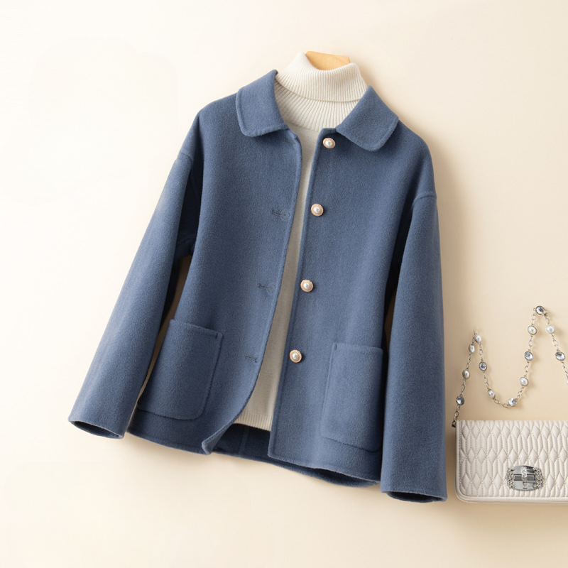 Cashmere cropped jacket for women, designed with a chic doll collar and buttons, offering warmth and style for winter.