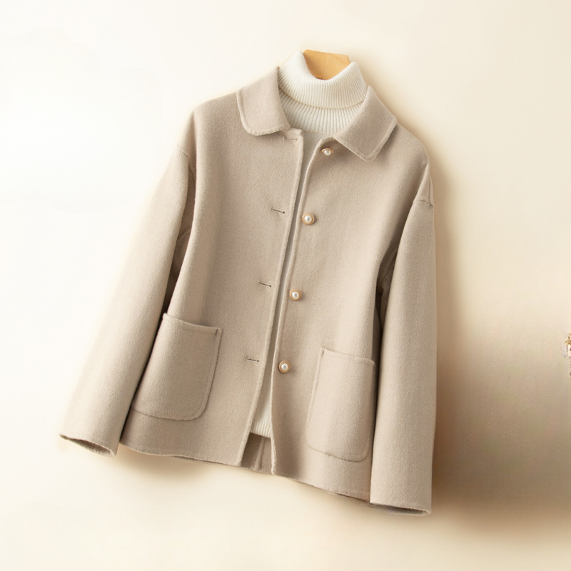 Luxury pure cashmere cropped coat for women, featuring a comfortable doll collar, perfect for sophisticated fall and winter outfits.