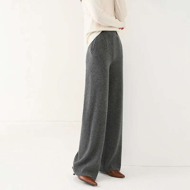 Model wearing comfortable women's merino wool wide-leg lounge pants, paired with a matching top